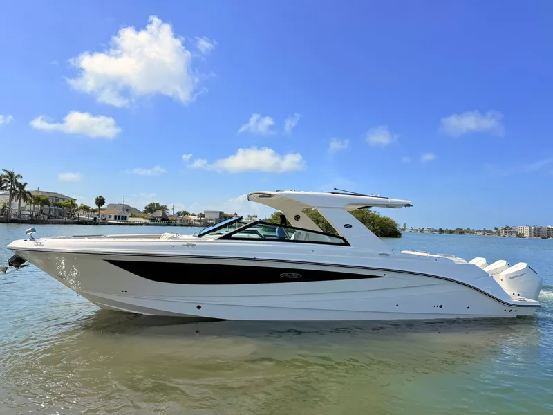 Slide: The Image of 2026 Sea Ray SLX 400 Outboard on calm water under sunny skies. - 25