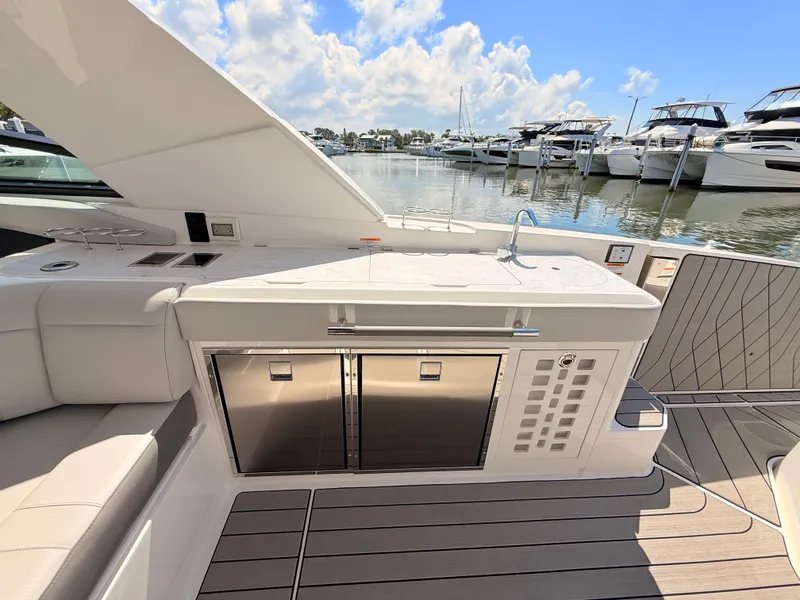 Slide: The Image of Interior view of 2026 Sea Ray SLX 400 Outboard with modern amenities. - 42