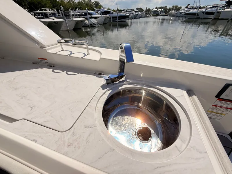 Slide: The Image of 2026 Sea Ray SLX 400 Outboard with sink at marina. - 45