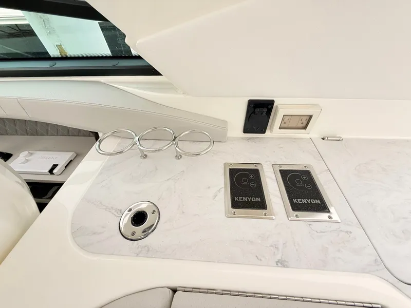 Slide: The Image of Interior of 2026 Sea Ray SLX 400 Outboard with Kenyon controls. - 49
