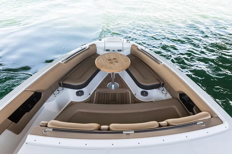 Slide: The Image of 2026 Sea Ray SLX 400 Outboard on calm water under clear sky. - 7