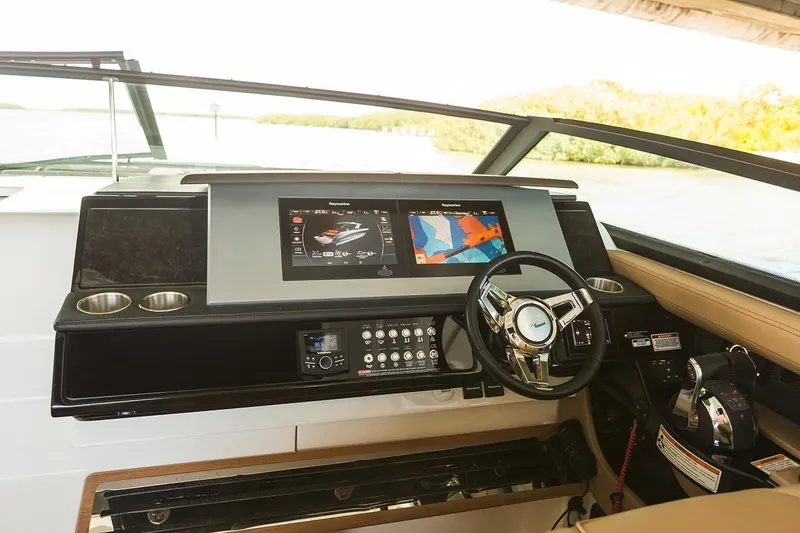 Slide: The Image of 2026 Sea Ray SLX 400 Outboard on calm water under clear sky. - 8