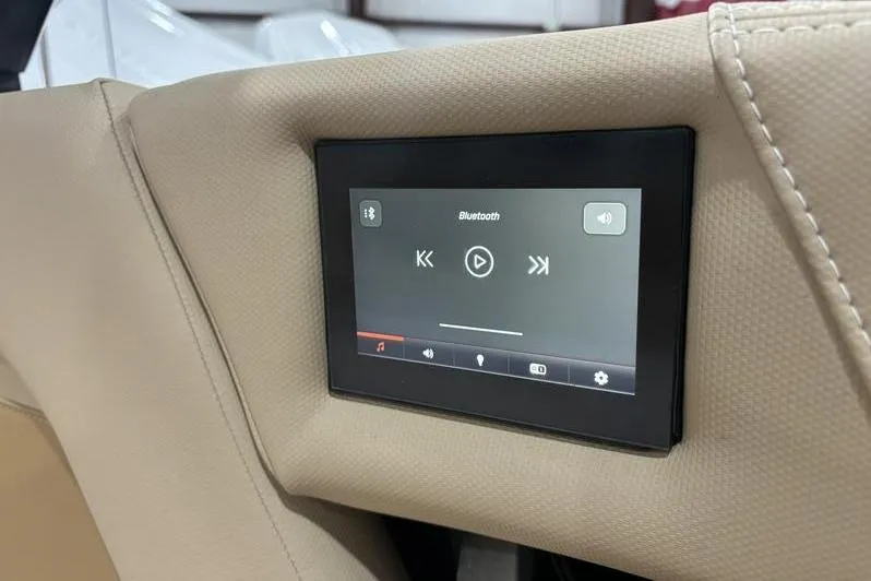 Slide: The Image of 2024 MasterCraft X24 boat interior with Bluetooth touchscreen control panel. - 10