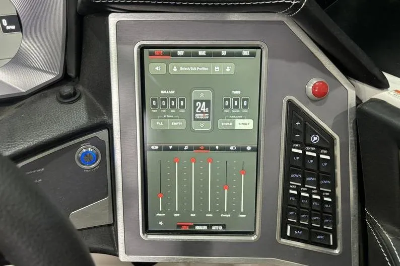 Slide: The Image of 2024 MasterCraft X24 boat control panel with touchscreen interface and adjustment buttons. - 14