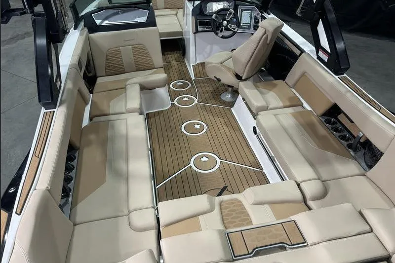 Slide: The Image of 2024 MasterCraft X24 boat interior with luxurious seating and modern dashboard design. - 4