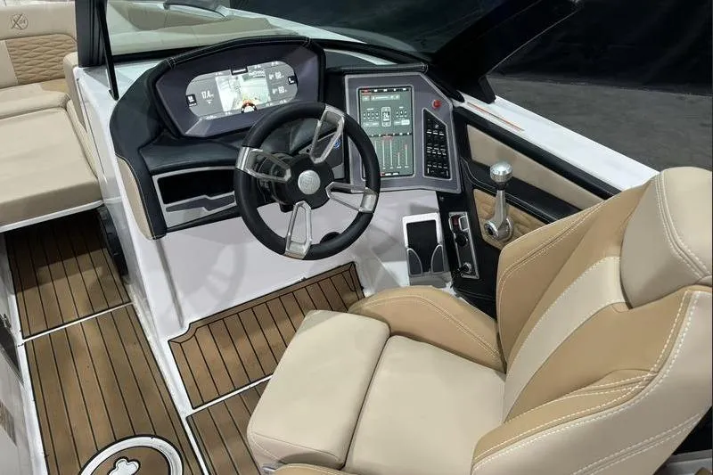 Slide: The Image of 2024 MasterCraft X24 boat interior with modern dashboard and luxurious seating. - 9