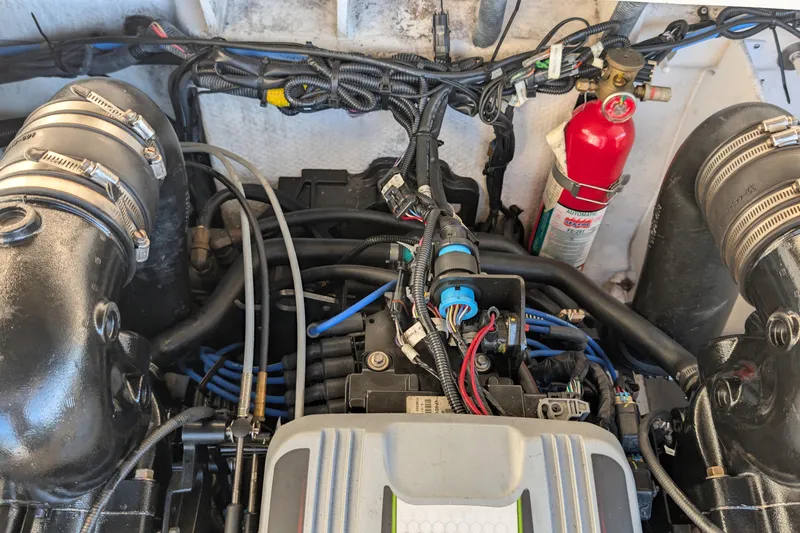 Slide: The Image of Engine compartment of a 2011 Sea Ray 240 Sundeck with visible fire extinguisher. - 22