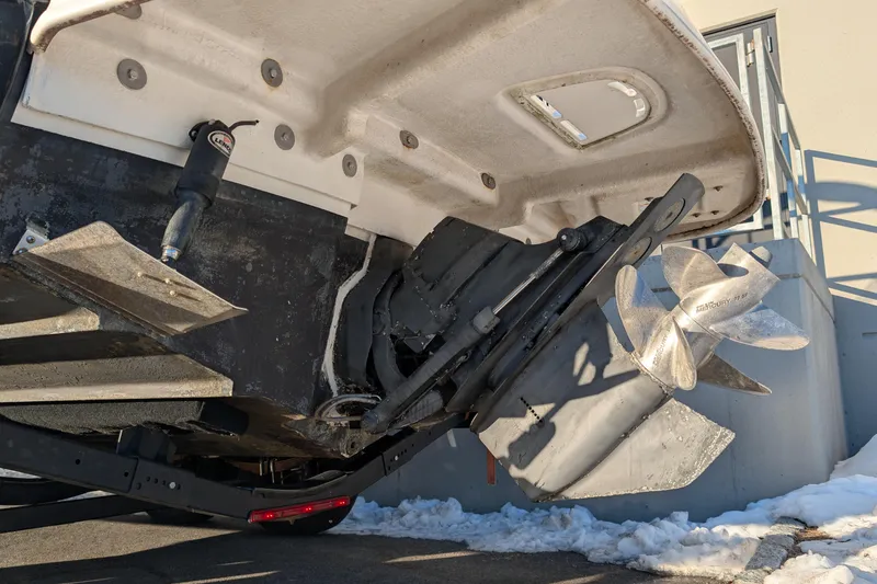 Slide: The Image of 2011 Sea Ray 240 Sundeck boat propeller and stern view in snowy setting. - 4