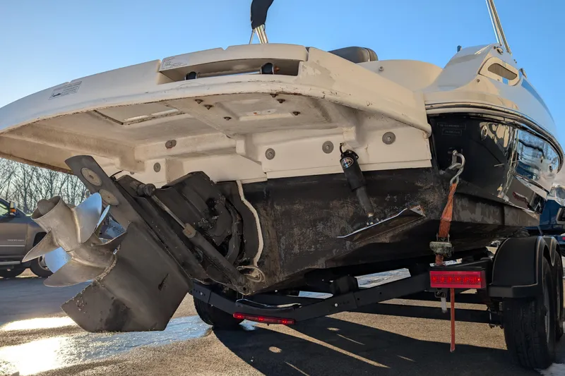 Slide: The Image of 2011 Sea Ray 240 Sundeck boat on trailer, showing propeller and stern details. - 5