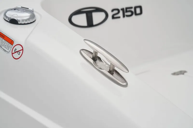 Slide: The Image of Manufacturer Provided Image: 2025 Tahoe 2150 boat cleat and logo detail on white surface. - 27