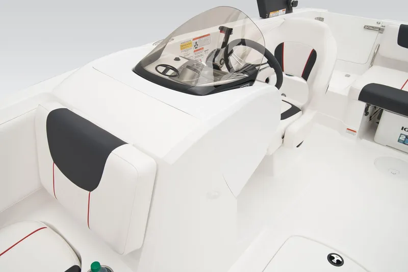 Slide: The Image of Manufacturer Provided Image: 2025 Tahoe 2150 boat interior with sleek white seating and modern steering console. - 44