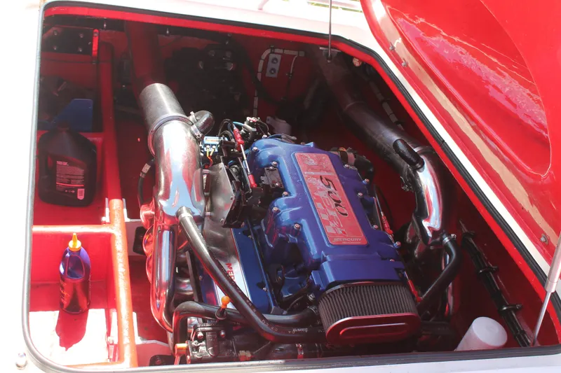 Slide: The Image of Engine compartment of a 2004 Spectre 36 Cat boat with visible Mercury engine. - 12
