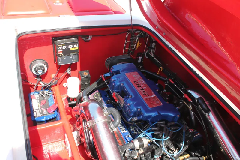 Slide: The Image of Engine compartment of a 2004 Spectre 36 Cat boat with visible components and wiring. - 15