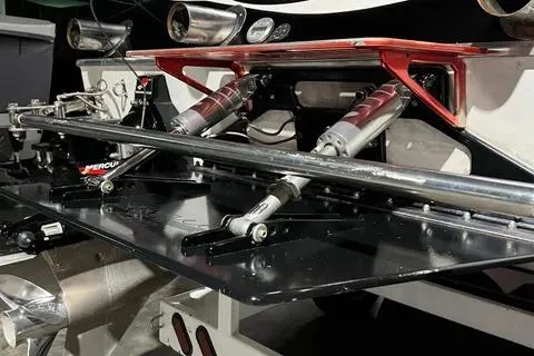 Slide: The Image of 2004 Spectre 36 Cat boat engine components with hydraulic systems and Mercury branding. - 19