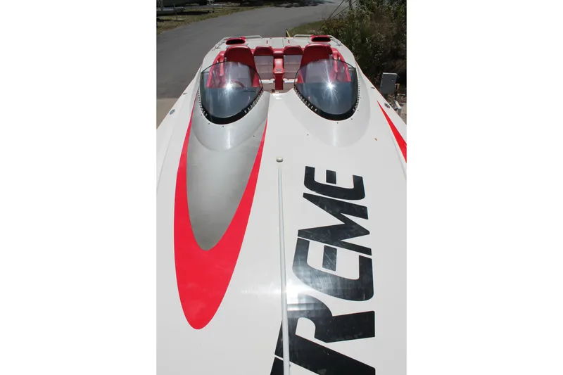 Slide: The Image of 2004 Spectre 36 Cat powerboat with red accents and dual cockpits. - 7