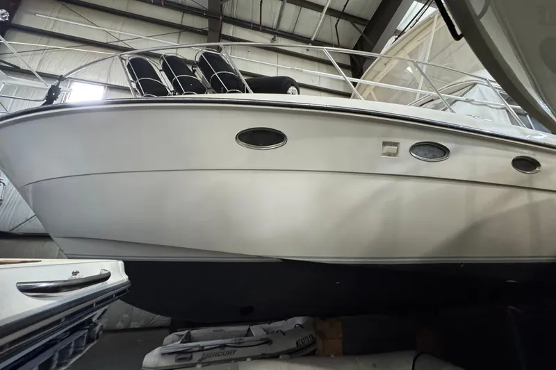 Slide: The Image of 1989 Dyna Craft 45 yacht in storage, showcasing sleek design and portholes. - 11