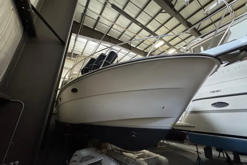 Slide: The Image of 1989 Dyna Craft 45 yacht stored indoors, showcasing sleek design and sturdy build. - 12