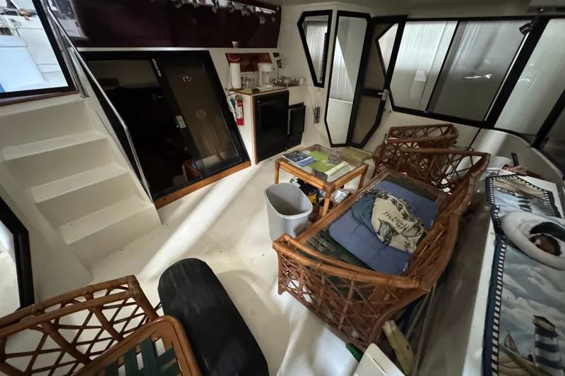 Slide: The Image of Interior of 1989 Dyna Craft 45 yacht with wicker furniture and kitchenette. - 19