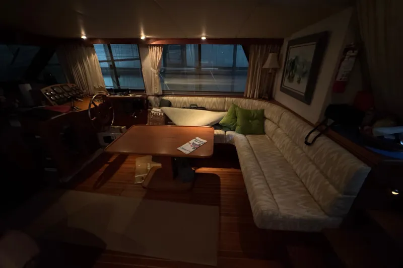 Slide: The Image of Cozy interior of 1989 Dyna Craft 45 yacht with seating and table. - 23
