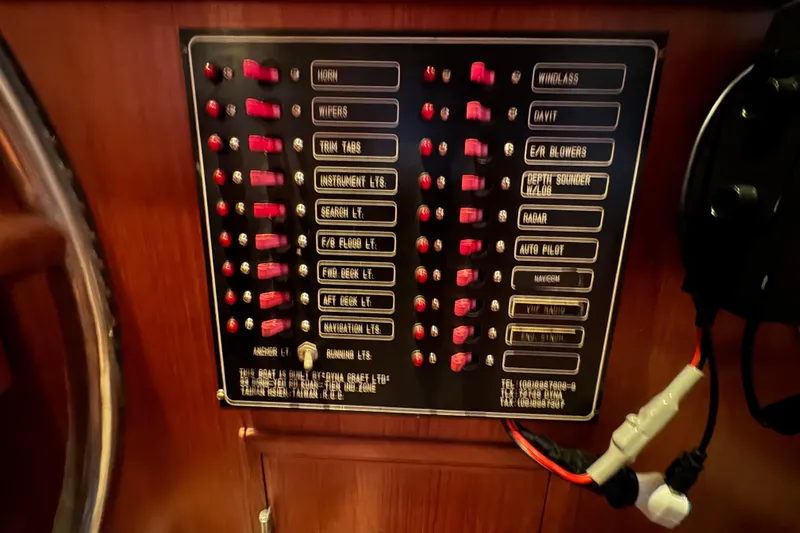 Slide: The Image of Control panel on 1989 Dyna Craft 45 boat with labeled switches and indicators. - 28