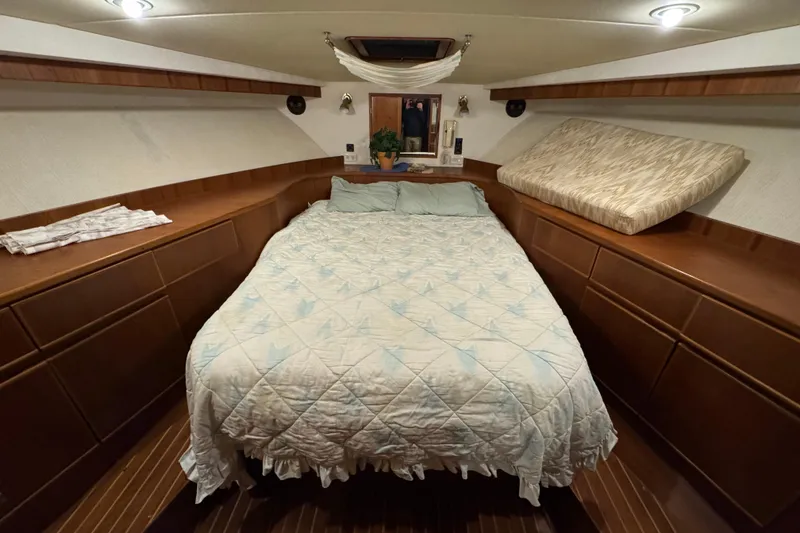 Slide: The Image of Cozy cabin interior of 1989 Dyna Craft 45 yacht with a comfortable bed and wooden accents. - 34