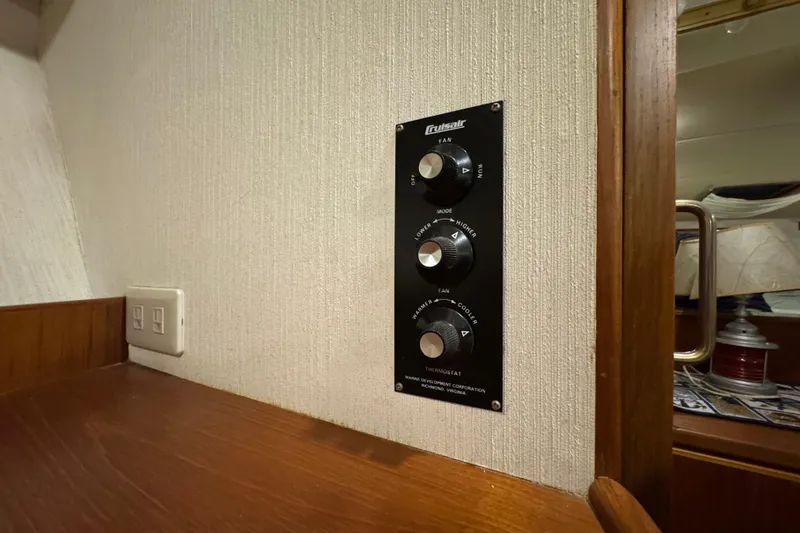 Slide: The Image of Control panel on 1989 Dyna Craft 45 yacht interior, featuring fan and thermostat settings. - 36