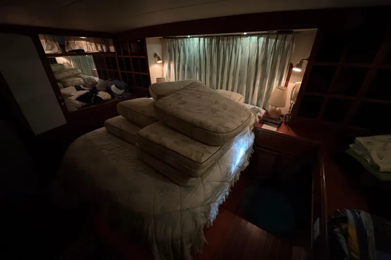 Slide: The Image of Cozy cabin interior of 1989 Dyna Craft 45 yacht with stacked cushions and ambient lighting. - 38