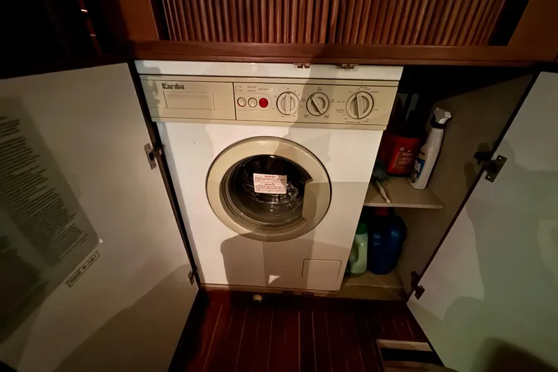 Slide: The Image of Laundry area with a built-in washing machine on a 1989 Dyna Craft 45 yacht. - 40