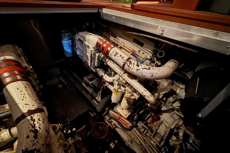 Slide: The Image of Engine compartment of 1989 Dyna Craft 45 boat, showing detailed mechanical components. - 43