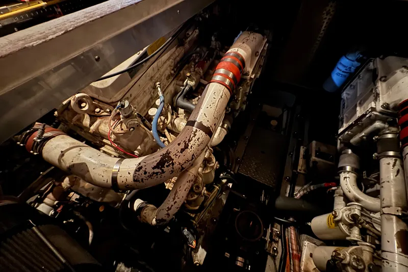 Slide: The Image of Engine compartment of a 1989 Dyna Craft 45, showcasing mechanical components and piping. - 44