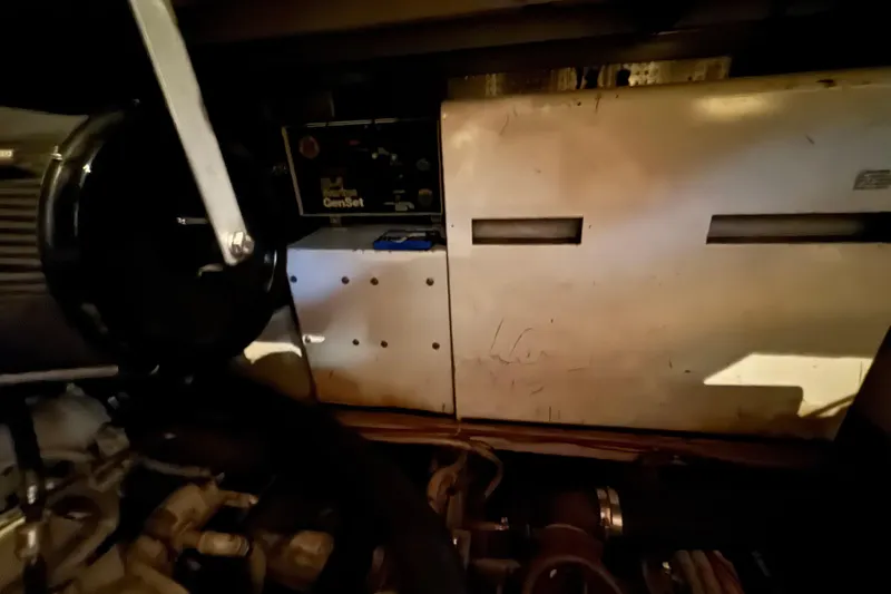 Slide: The Image of Engine room of 1989 Dyna Craft 45 with visible generator and components. - 46