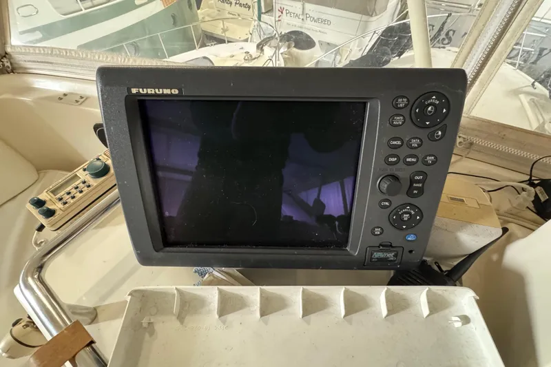 Slide: The Image of Furuno navigation system on 1989 Dyna Craft 45 yacht dashboard. - 49