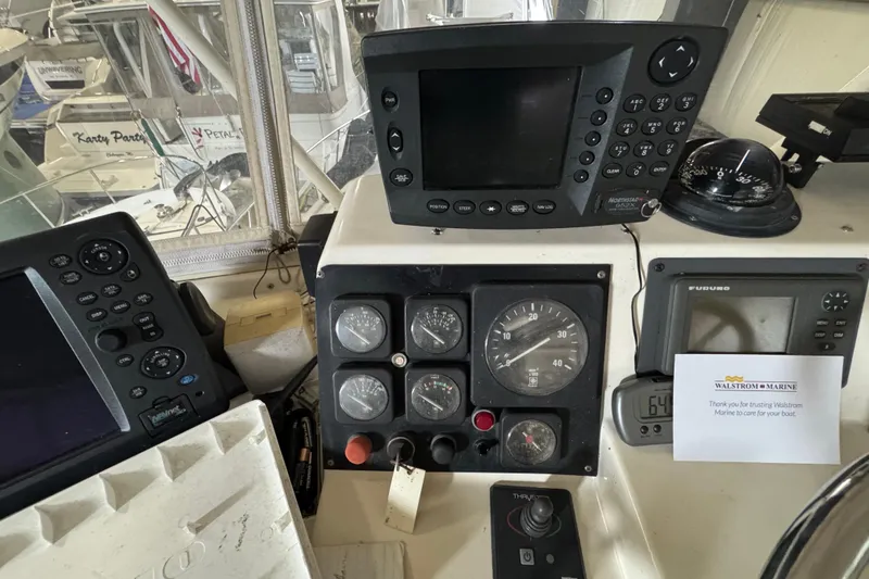 Slide: The Image of Control panel of a 1989 Dyna Craft 45 boat with navigation instruments. - 50