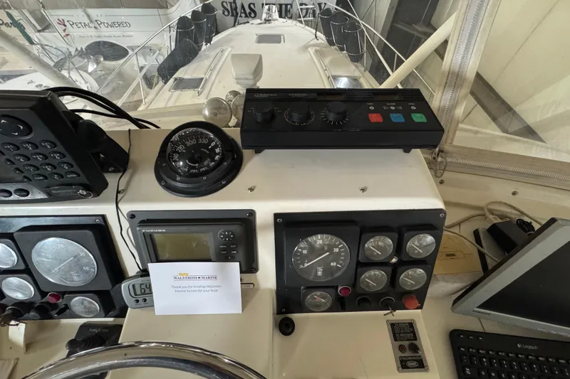 Slide: The Image of Control panel of a 1989 Dyna Craft 45 boat with navigation instruments. - 51