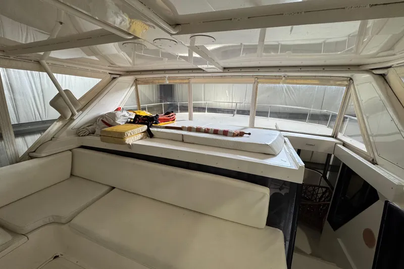 Slide: The Image of Interior of 1989 Dyna Craft 45 yacht with white seating and cushions. - 53