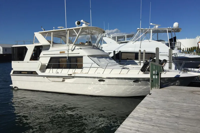 Slide: The Image of 1989 Dyna Craft 45 yacht docked at marina under clear blue sky. - 9