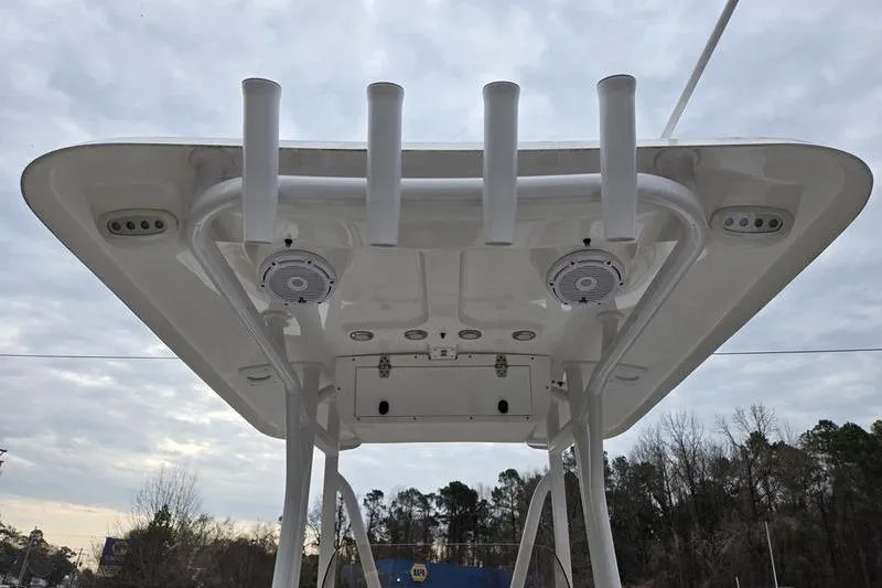 Slide: The Image of 2024 Sea Hunt Ultra 234 boat T-top with rod holders and speakers. - 10