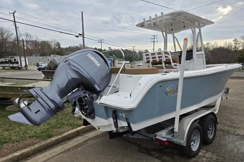Slide: The Image of 2024 Sea Hunt Ultra 234 boat on trailer with Yamaha outboard motor. - 4