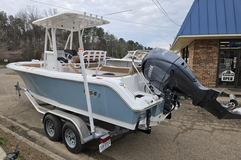 Slide: The Image of 2024 Sea Hunt Ultra 234 boat on trailer with Yamaha outboard motor. - 5