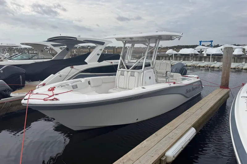 The Image of 2024 Sea Fox 228 Commander boat docked at marina, overcast sky. - 0