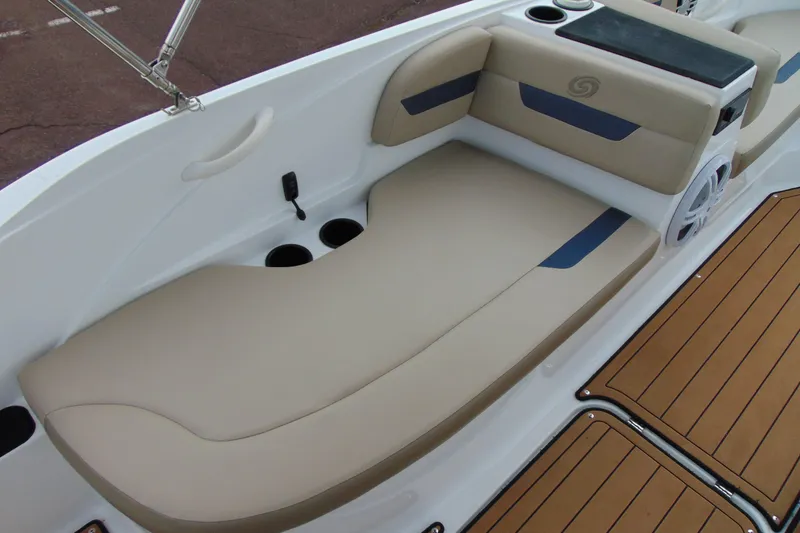 Slide: The Image of 2023 Hurricane SunDeck Sport 185 OB boat interior with beige seating and cup holders. - 12