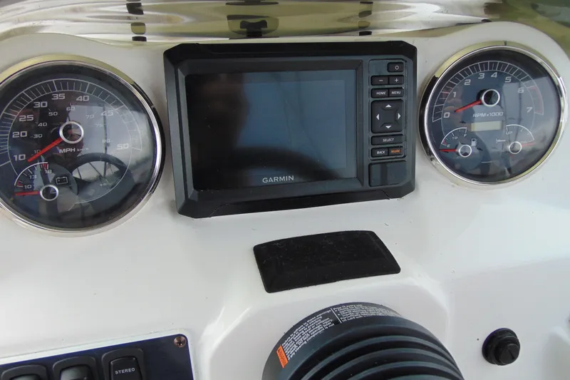 Slide: The Image of Dashboard of 2023 Hurricane SunDeck Sport 185 OB with Garmin display and gauges. - 14