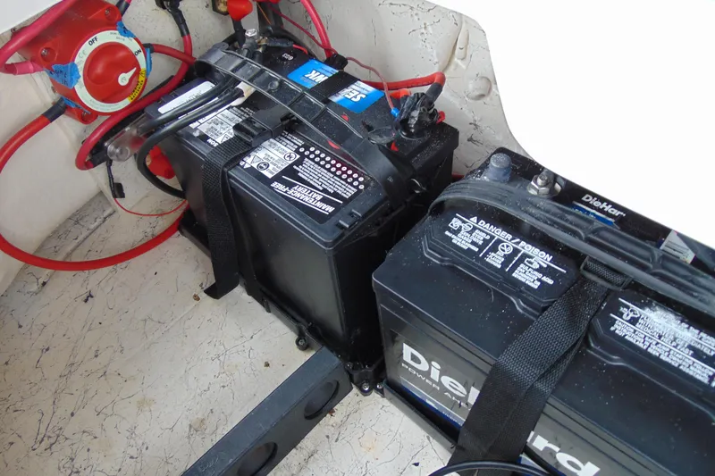 Slide: The Image of Batteries and wiring in 2023 Hurricane SunDeck Sport 185 OB boat. - 17