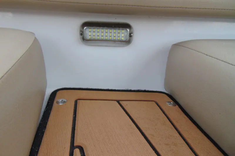 Slide: The Image of 2023 Hurricane SunDeck Sport 185 OB interior with LED light and wooden flooring. - 19