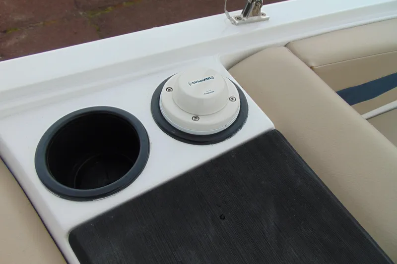 Slide: The Image of 2023 Hurricane SunDeck Sport 185 OB boat interior with cup holder and SiriusXM antenna. - 20