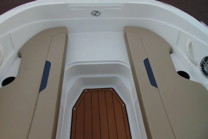 Slide: The Image of 2023 Hurricane SunDeck Sport 185 OB interior with beige seating and wood-style flooring. - 21