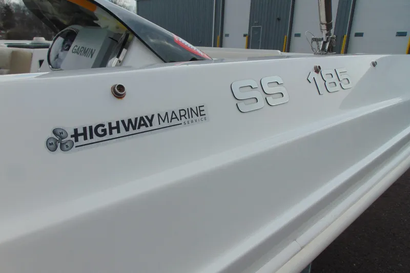 Slide: The Image of 2023 Hurricane SunDeck Sport 185 OB boat with Highway Marine Service branding. - 8
