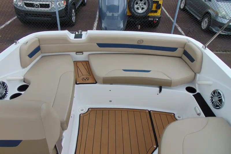 Slide: The Image of 2023 Hurricane SunDeck Sport 185 OB boat interior with beige seating and wood-style flooring. - 9