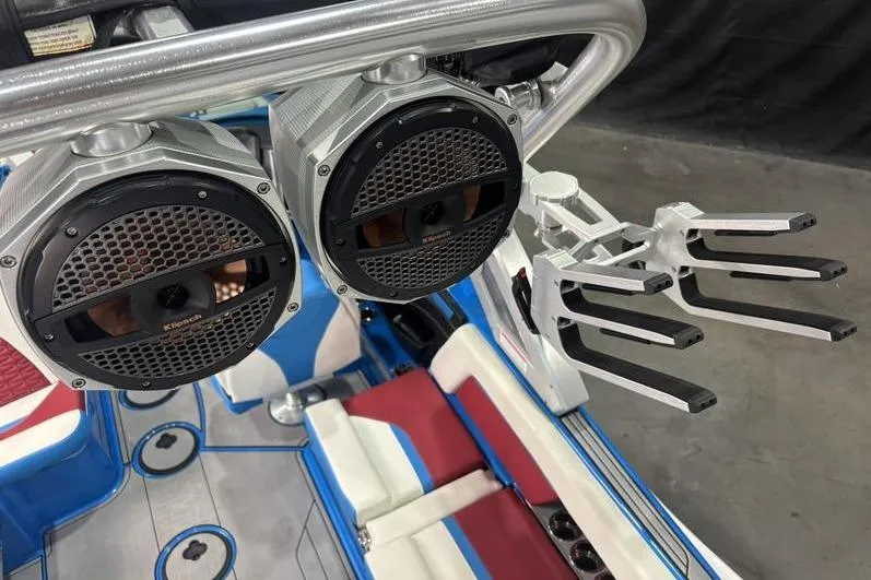 Slide: The Image of 2024 MasterCraft X24 boat interior with speakers and wakeboard racks. - 15