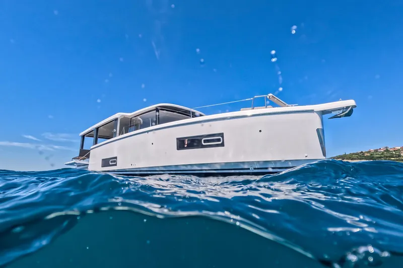 Slide: The Image of 2026 Jeanneau Sea Loft 480 yacht on blue ocean under clear sky. - 1